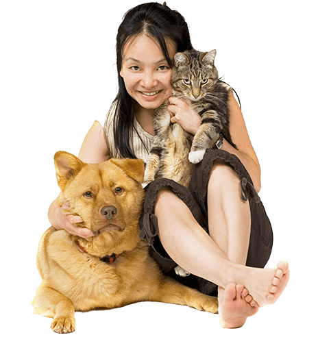 woman hugging her pets